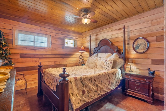 bedroom with concrete flooring, wooden ceiling, and wooden walls