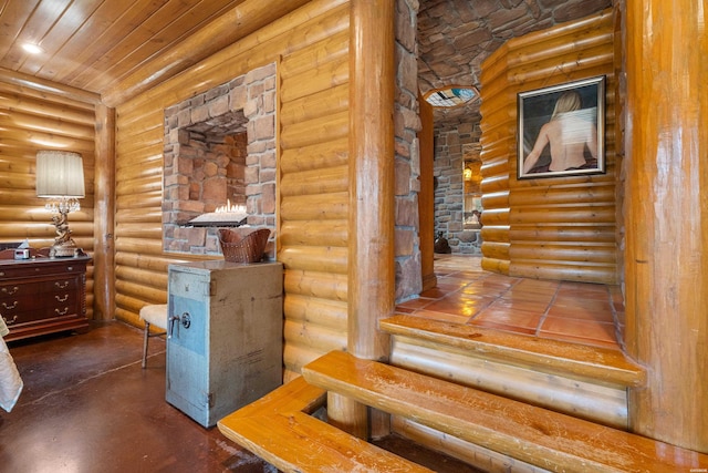 interior space featuring wooden ceiling and log walls