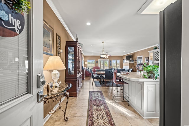 interior space with recessed lighting, light tile patterned flooring, and crown molding