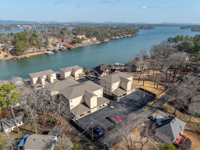 drone / aerial view with a water view and a residential view