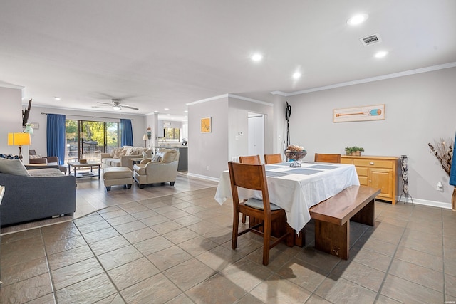 dining room featuring baseboards, recessed lighting, visible vents, and crown molding