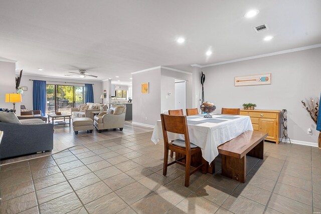 dining room featuring baseboards, recessed lighting, visible vents, and crown molding