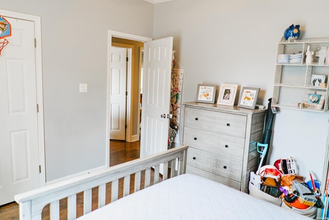 bedroom featuring wood finished floors