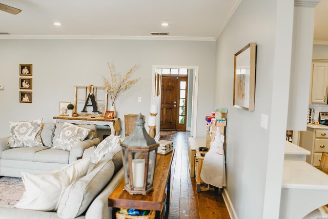 living area with baseboards, visible vents, ornamental molding, dark wood-style flooring, and recessed lighting