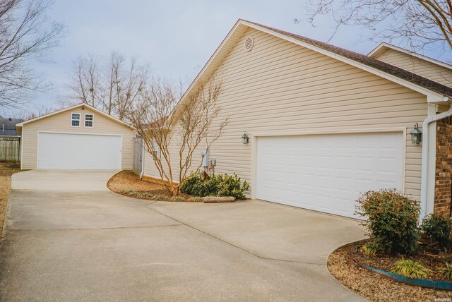 view of side of home with a garage