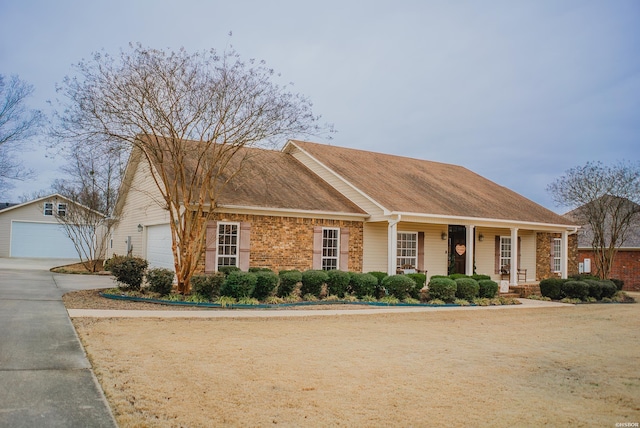 ranch-style home with covered porch and brick siding