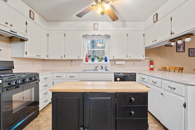 kitchen featuring white cabinets, light countertops, a kitchen island, and black appliances