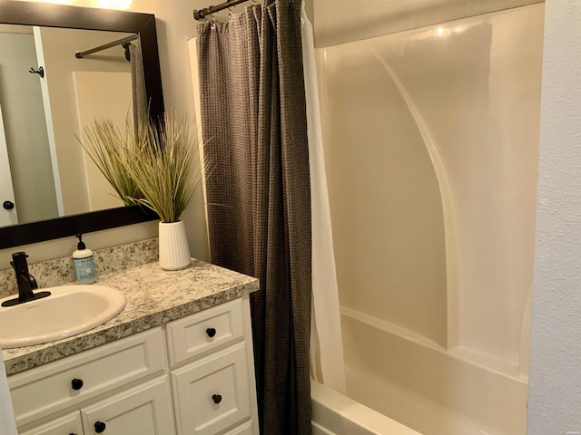full bath featuring vanity and shower / tub combo with curtain