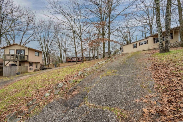 view of street featuring gravel driveway