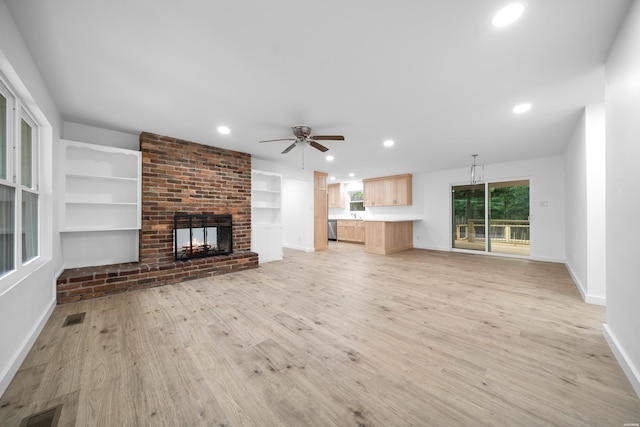 101 Southern Hills Dr, Hot Springs, AR 71913 - unfurnished living room featuring baseboards, recessed lighting, light wood-type flooring, ceiling fan, and a fireplace