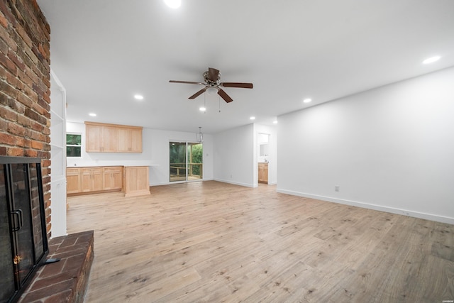 101 Southern Hills Dr, Hot Springs, AR 71913 - unfurnished living room featuring a fireplace, ceiling fan, light wood-type flooring, recessed lighting, and baseboards