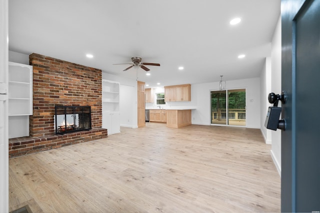 101 Southern Hills Dr, Hot Springs, AR 71913 - unfurnished living room featuring light wood-style floors, ceiling fan, a brick fireplace, recessed lighting, and baseboards