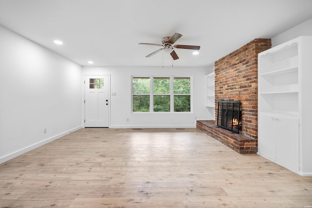 101 Southern Hills Dr, Hot Springs, AR 71913 - unfurnished living room with a brick fireplace, ceiling fan, wood finished floors, recessed lighting, and baseboards