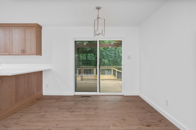 101 Southern Hills Dr, Hot Springs, AR 71913 - unfurnished dining area featuring light wood-style flooring and baseboards