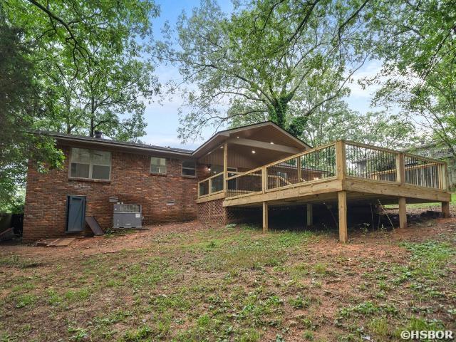 101 Southern Hills Dr, Hot Springs, AR 71913 - back of house with a wooden deck and brick siding