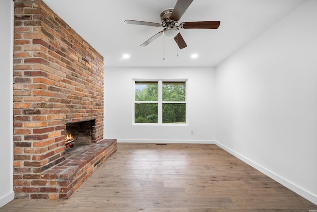 101 Southern Hills Dr, Hot Springs, AR 71913 - unfurnished living room featuring a fireplace, wood finished floors, ceiling fan, baseboards, and recessed lighting