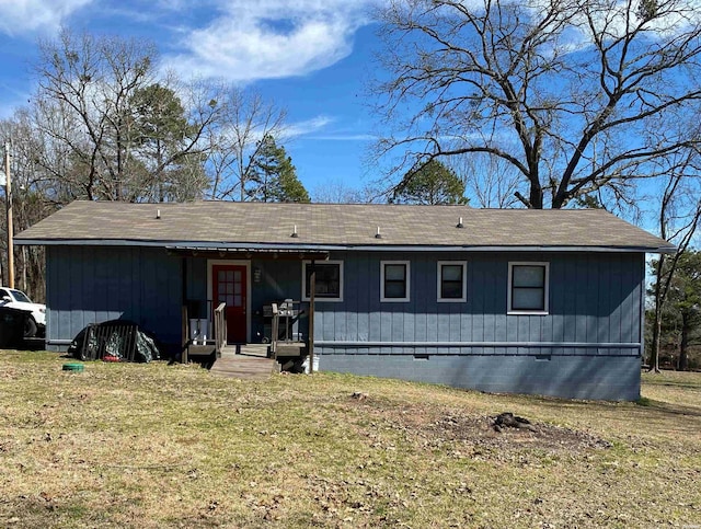 view of front facade with a front lawn and crawl space