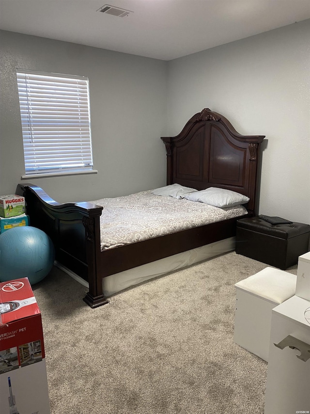 bedroom with carpet floors and visible vents