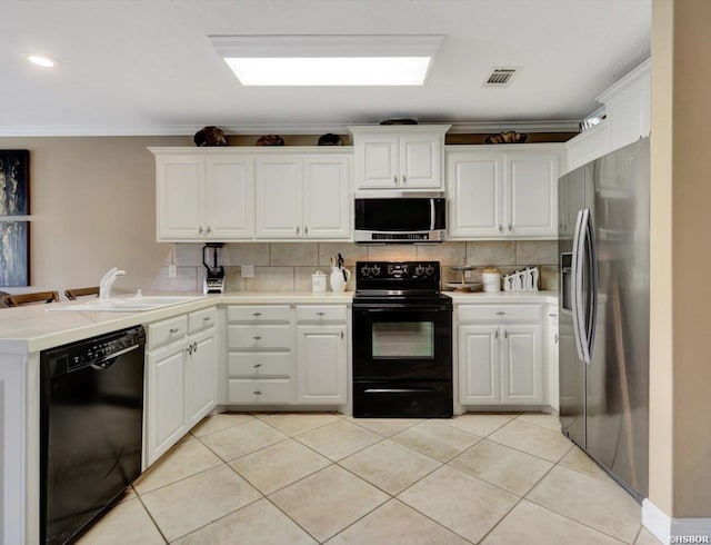 182 Villa Pointe Pt Unit B, Hot Springs, AR 71913 - kitchen with black appliances, a peninsula, ornamental molding, tasteful backsplash, and white cabinets