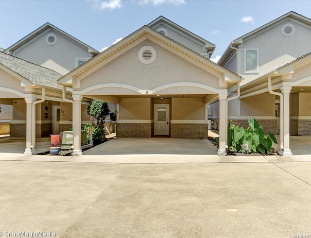 182 Villa Pointe Pt Unit B, Hot Springs, AR 71913 - view of front of property with brick siding, stucco siding, and driveway
