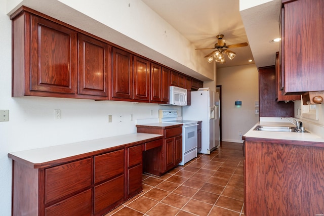 kitchen featuring ceiling fan, light countertops, white appliances, and a sink