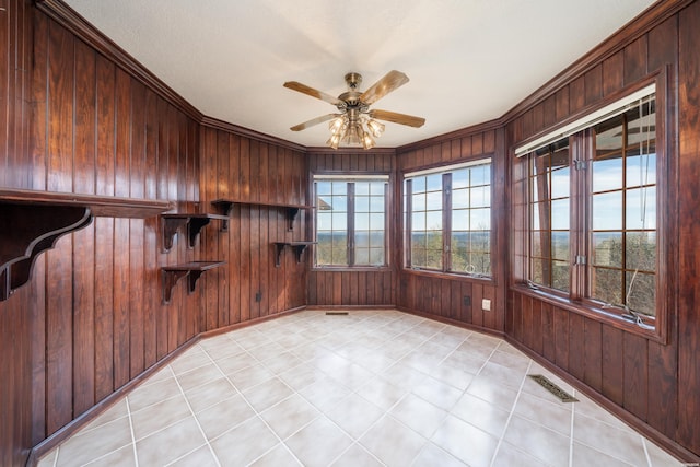 interior space featuring ceiling fan and visible vents