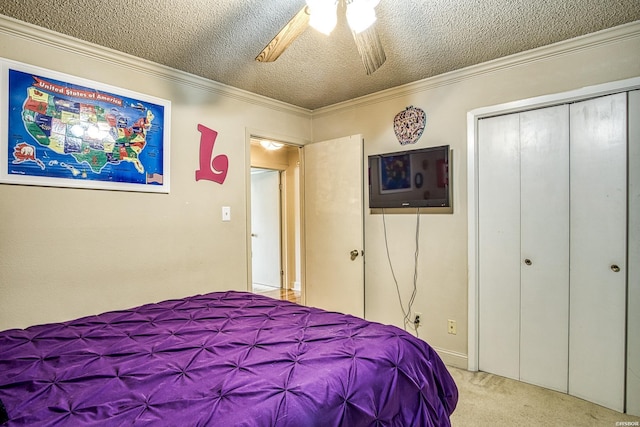 208 Daffodil St Unit D-1, Hot Springs, AR 71913 - bedroom featuring a textured ceiling, ceiling fan, light colored carpet, ornamental molding, and a closet