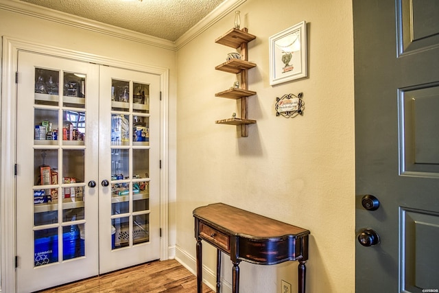 208 Daffodil St Unit D-1, Hot Springs, AR 71913 - doorway to outside with light wood-style floors, french doors, crown molding, and a textured ceiling