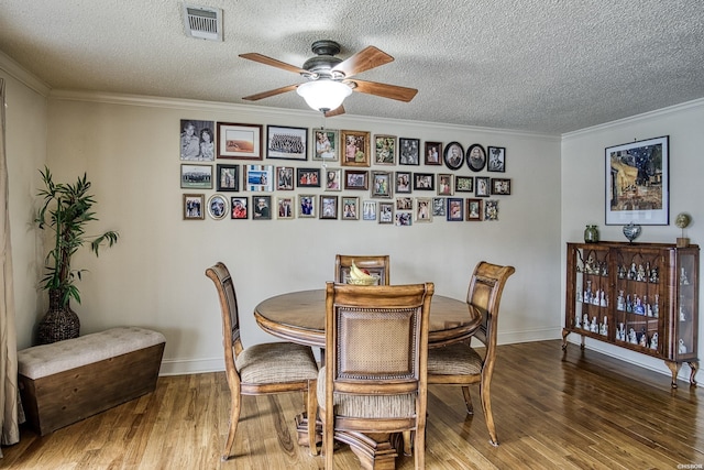 208 Daffodil St Unit D-1, Hot Springs, AR 71913 - dining space featuring ceiling fan, a textured ceiling, ornamental molding, and wood finished floors
