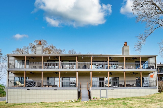 208 Daffodil St Unit D-1, Hot Springs, AR 71913 - back of house featuring a balcony, ceiling fan, and a chimney