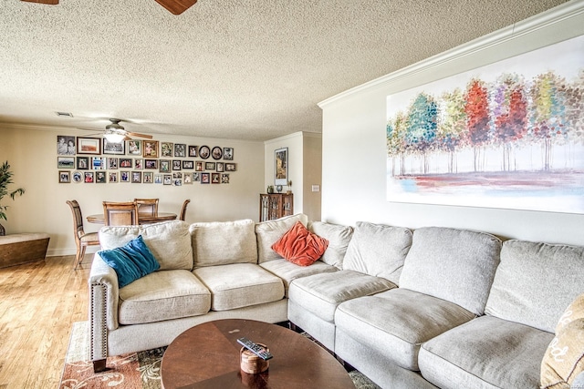 208 Daffodil St Unit D-1, Hot Springs, AR 71913 - living room featuring crown molding, ceiling fan, a textured ceiling, and wood finished floors