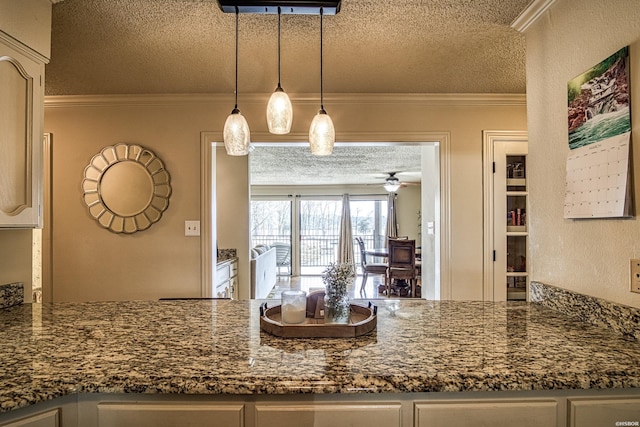 208 Daffodil St Unit D-1, Hot Springs, AR 71913 - kitchen with a textured ceiling, ornamental molding, dark stone counters, and pendant lighting