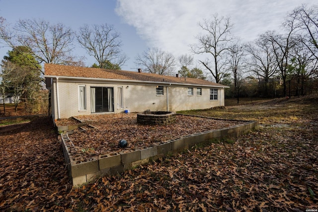 rear view of house with brick siding