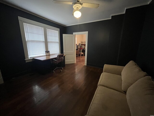 office area featuring dark wood-style floors, ceiling fan, baseboards, and crown molding