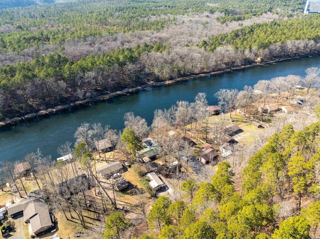 aerial view featuring a water view and a wooded view