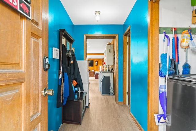 corridor with light wood-style flooring