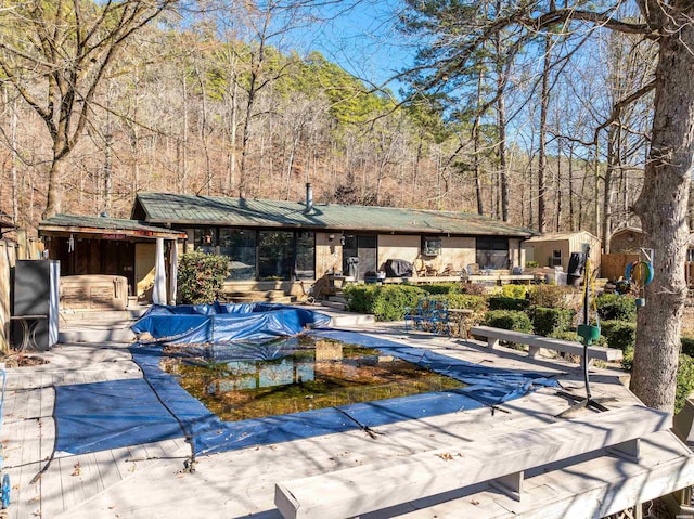 view of pool with a patio area and a covered pool