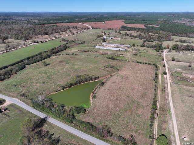 aerial view with a water view and a rural view