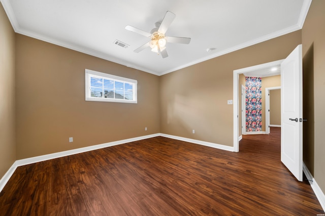 121 Gardens Gate Dr, Hot Springs, AR 71913 - spare room with baseboards, dark wood-style flooring, ornamental molding, ceiling fan, and visible vents