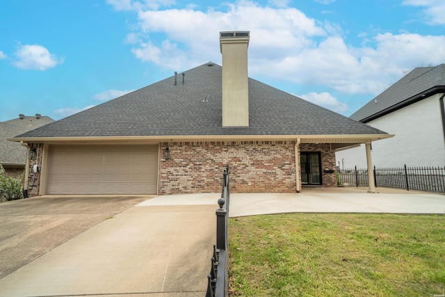 121 Gardens Gate Dr, Hot Springs, AR 71913 - rear view of property with a chimney, brick siding, fence, a garage, and a shingled roof