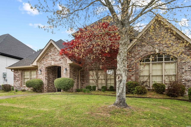 121 Gardens Gate Dr, Hot Springs, AR 71913 - french provincial home featuring brick siding, roof with shingles, and a front yard