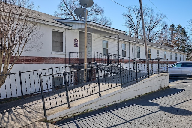 210 Aberina St Unit C-5, Hot Springs, AR 71913 - view of property exterior featuring a fenced front yard and brick siding