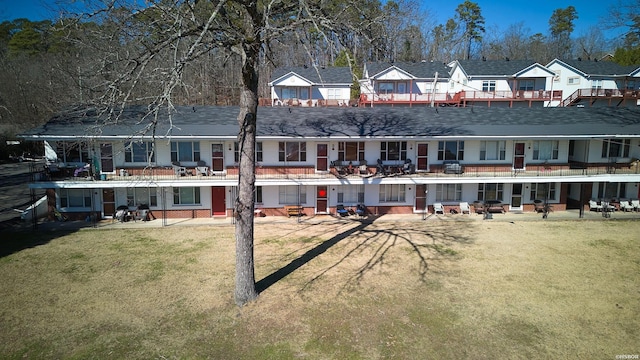 210 Aberina St Unit C-5, Hot Springs, AR 71913 - rear view of property with a lawn, a residential view, brick siding, and roof with shingles