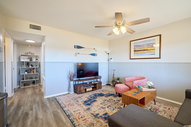 210 Aberina St Unit C-5, Hot Springs, AR 71913 - living room with wood finished floors, ceiling fan, and wainscoting