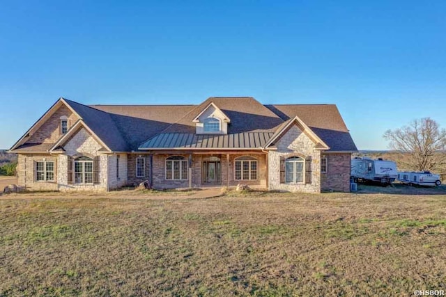 3950 Airport Rd, Pearcy, AR 71964 - french country style house featuring stone siding, a standing seam roof, a front lawn, and metal roof