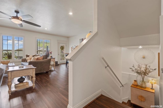 stairway with baseboards, a ceiling fan, recessed lighting, and wood finished floors