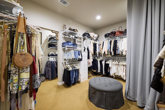 walk in closet featuring carpet flooring and visible vents