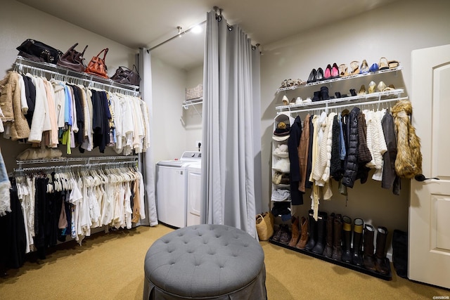 walk in closet featuring carpet and washing machine and clothes dryer