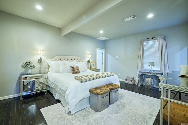 bedroom with baseboards, visible vents, dark wood-type flooring, and beam ceiling