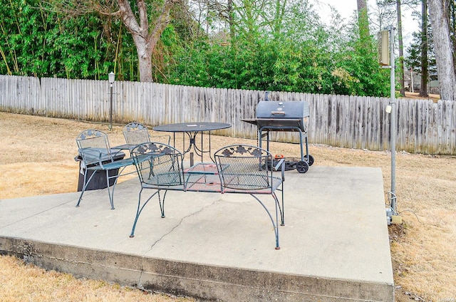 view of patio with a fenced backyard and grilling area